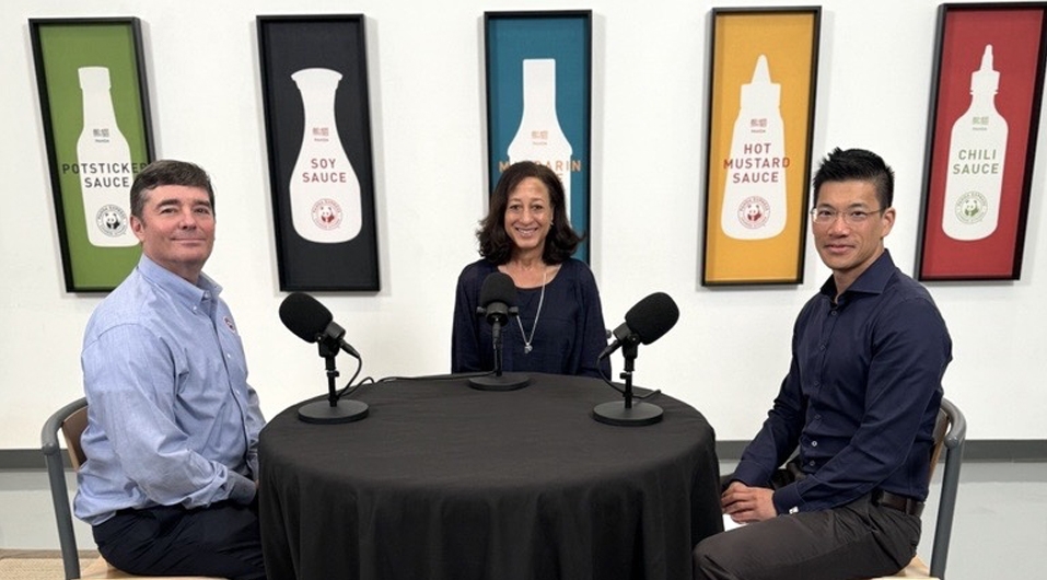 Monte, Kim, and Leo sit at table recording podcast